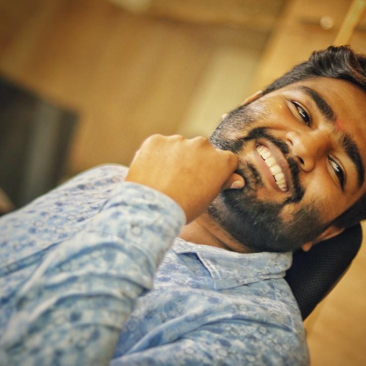 Alex Rivera, Lead Design Curator at Endless Morning Path, reviewing corporate floral arrangements